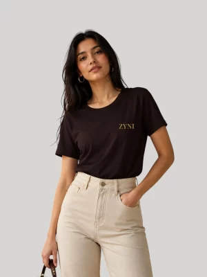 Woman wearing ZYNI Premium Coffee Brown Cotton T-Shirt with minimalist embroidered logo.